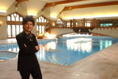 Environmental Portrait of Elise Kalles next to interior swimming