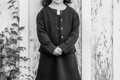Black & White Outdoor Portrait of young girl wearing a sweater &