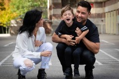 Outdoor Casual Family Portrait of two parents with young son in