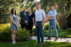 Casual outdoor Family Portrait of two parents and three adult ch