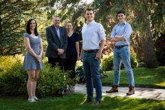Casual outdoor Family Portrait of two parents and three adult ch