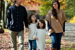 Outdoor Family Portrait of two parents and two young daughters a