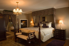 Photograph of residential interior of master bedroom with ensuit