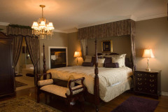 Photograph of residential interior of master bedroom with ensuit