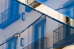 Photograph of Blue, Transluscent Sun Shade over Pedestrian stree