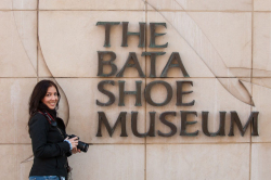 Maruan Diaz standing next to The Bata Shoe Museum signage in Tor