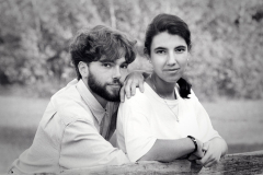 Young Couple Leaning on Split Cedar Rail Fence as Photographed f