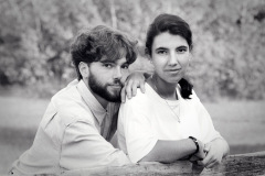 Young Couple Leaning on Split Cedar Rail Fence as Photographed f
