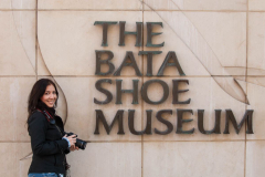 Maruan Diaz standing next to The Bata Shoe Museum signage in Tor